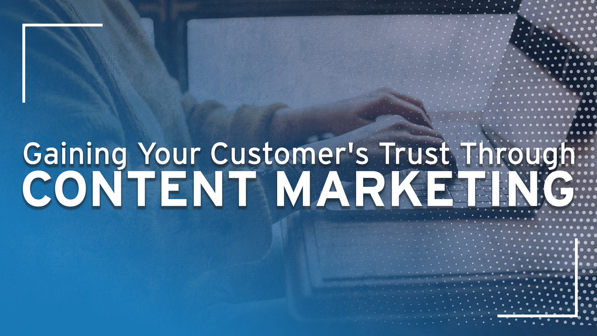 A person typing on a laptop behind the text "Gaining Your Customer's Trust Through Content Marketing"